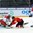 ZUG, SWITZERLAND - APRIL 21: The Czech Republic's Daniel Vladar #30 makes the save against Switzerland's Damien Riat #9 while Daniel Krenzelok #25 looks on during preliminary round action at the 2015 IIHF Ice Hockey U18 World Championship. (Photo by Francois Laplante/HHOF-IIHF Images)